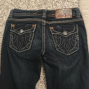 Boot cut jeans , flame pocket design